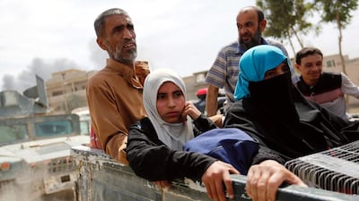 Displaced Iraqis flee during clashes between government forces and ISIL militants in western Mosul on May 16, 2017. Danish Siddiqui / Reuters
