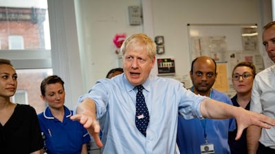 British Prime Minister Boris Johnson visiting North Manchester General Hospital ahead of the Conservative party conference in the city. Andy Stenning / pool via Reuters