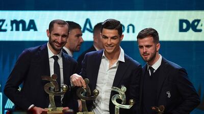 Giorgio Chiellini, Cristiano Ronaldo and Miralem Pjanic on stage together after being named in the Gran Gala del Calcio 2019 Best XI. AFP