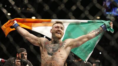 Conor McGregor reacts after defeating Jose Aldo during a featherweight championship mixed martial arts bout at UFC 194, Saturday, Dec. 12, 2015, in Las Vegas. (AP Photo/John Locher)