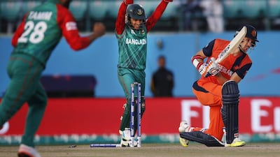 Netherlands’ Ben Cooper, right, is bowled by Bangladesh’s Shakib Al Hasan during the ICC World T20 2016 cricket tournament at the Himachal Pradesh Cricket Association (HPCA) stadium in Dharmsala, India, Wednesday, March 9, 2016. (AP Photo/Tsering Topgyal)