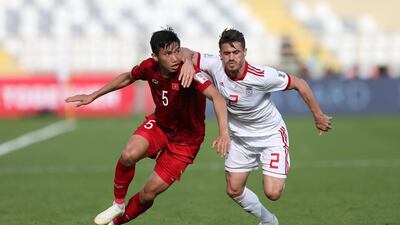 Vorya Ghafouri ,right, of Iran in action against Doan Van Hau of Vietnam during the 2019 Asian Cup Group D match at Al Nahyan Stadium in Abu Dhabi. EPA