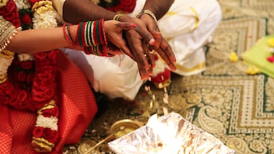 A priest from India's southern Tamil Nadu state guided the bridal couple through the ceremony