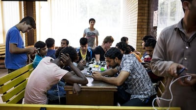 Asylum seekers at the Adasevci camp. Christopher Pike / The National
