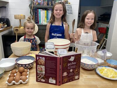 From left, Caspian, Indiana and Fox ready to try their hand at recipes from Afternoon Tea Magic, Official Snacks, Sips and Sweets inspired by the Wizarding World. Photo: Gemma White