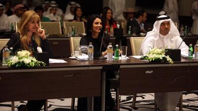 Doris Greif (from left), Diana Haddad and Mohamed Al Dhaheri, attend presentations by members of the Abu Dhabi ambassador programme in the capital yesterday. Sammy Dallal / The National