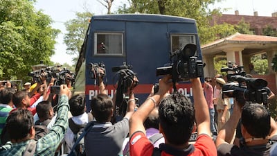 Media gather around a Punjab Police vehicle carrying the seven accused for the rape and murder of an eight-year-old nomadic girl in Kathua in Jammu and Kashmir, as verdict is expected to be delivered at the district court in Pathankot on June 10, 2019. Seven Hindu men will be sentenced at a later date. They face a minimum of life imprisonment and a maximum of death penalty. An eighth person allegedly involved, a juvenile, faces a separate trial. AFP
