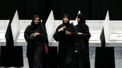 Women cast their ballots at Abu Dhabi National Exhibition Centre. Chris Whiteoak / The National