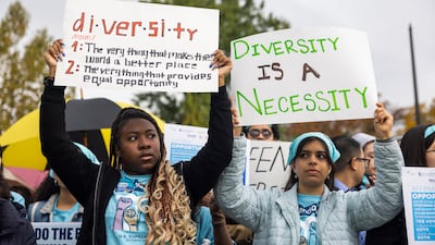 Supporters of affirmative action gather outside the US Supreme Court in Washington on Monday as the judges hear arguments in two cases challenging the consideration of race in college admissions. EPA