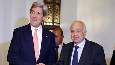 John Kerry, the US secretary of state, left, with the Arab League chief Nabil Elaraby in March. Mr Kerry returns to the region this week. AP Photo