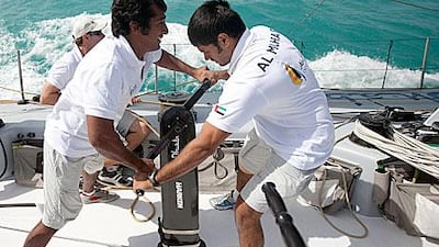 When not on the sea, Butti Al Muhairi, left, and Adil Khalid are learning the drills with the Shore Team in the workshop.