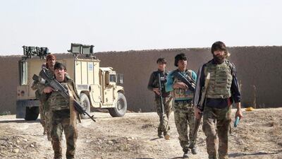 Afghan soldiers patrol in Helmand province, where the Taliban is pressing an offensive to capture a key district, on December 21, 2015. Noor Mohammad / AFP