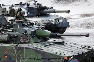 Finnish and Swedish personnel have already taken part in military drills with Nato. Reuters
