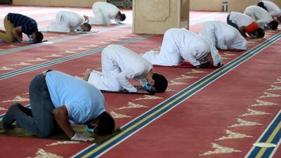 Worshippers at Al Farooq Omar Bin Al Khattab Mosque in Dubai kept a safe distance from one another. Chris Whiteoak / The National