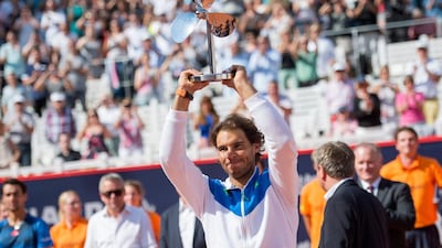Rafael Nadal of Spain celebrates with his trophy after winning the final against Fabio Fognini of Italy at the German Open in Hamburg on August 2, 2015. Daniel Reinhardt / EPA