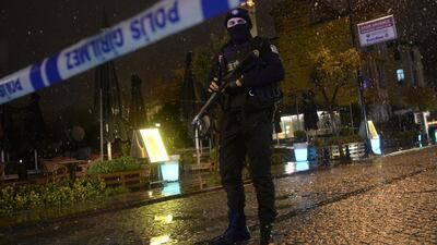 A police officer stands guard along a street after a female suicide bomber was killed on January 6, when she blew herself up in an attack on a police station in the main tourist district of central Istanbul. AFP Photo