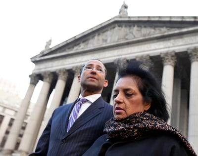 Roomy Khan exiting the Manhattan Federal Courthouse with her lawyer following her sentencing in New York in January 2013. Brendan McDermid / Reuters