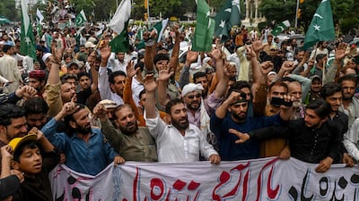 Demonstrators carrying Pakistan's national flags shout slogans as they participate in an anti-India protest in Lahore on May 11, 2025. AFP