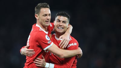 United's Cristiano Ronaldo celebrates with Nemanja Matic after scoring against Chelsea. AFP