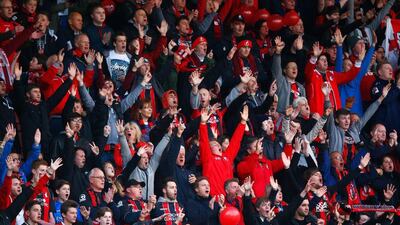 Bournemouth fans show their support during the team's 3-0 Championship win over Bolton on Monday night to earn Premier League promotion. Clive Rose / Getty Images
