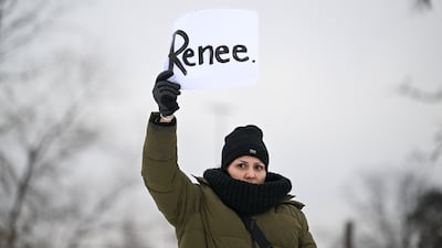 A protester holds a sign bearing the first name of the woman shot and killed by an Immigration and Customs Enforcement agent in Minnesota. EPA
