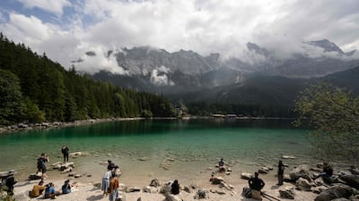 Tourists enjoy the view over the Eibsee lake, Grainau, near Garmisch-Partenkirchen, southern Germany. AFP