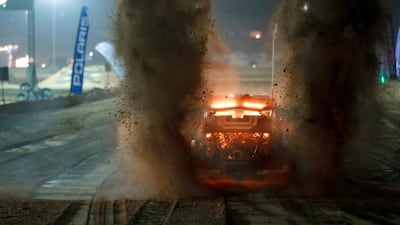 A 740-horsepower buggy rips the sand on the starting line during the nighttime UTV and Buggy race. Victor Besa / The National