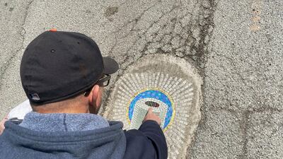 Bachor starts the work in his studio, then travels to the pothole site. Reuters