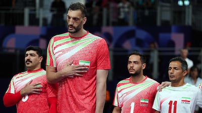 Iran's Morteza Mehrzadselakjani, second left, and his teammates before their men’s sitting volleyball match against Ukraine on Friday at the Paris Paralympics. AFP