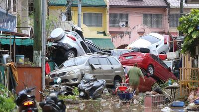 Piled-up cars after floods caused by Typhoon Kalmaegi in Cebu city, central Philippines. AP