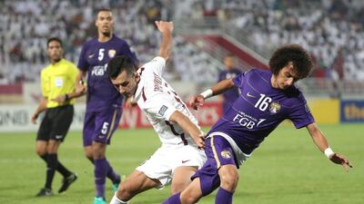 Al Ain’s Mohamed Abdulrahman vies with El Jaish’s Sardar Rashidov. Karim Jaafar / AFP