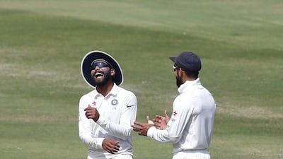 India's Ravindra Jadeja, left, shares a light moment with captain Virat Kohli during the last day of the one-off cricket Test match against Bangladesh in Hyderabad, India, on February 13, 2017. Aijaz Rahi / AP
