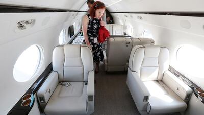 Visitors look at the interior of a Gulfstream G550 at the Dubai Airshow 2015 at the DWC airshow in Dubai last year. Pawan Singh / The National