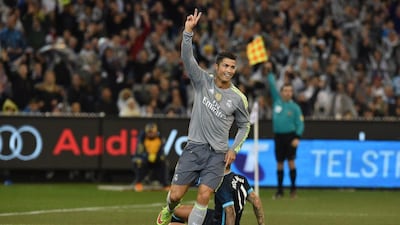 Real Madrid midfielder Cristiano Ronaldo reacts to the fans after scoring his team's second goal against Manchester City in a pre-season friendly on Friday. Paul Crock / AFP