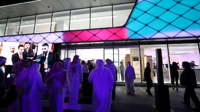 Crowds gather to see inside Bentley's new dealership in Abu Dhabi, which opened in January. Chris Whiteoak / The National
