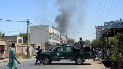 Afghan security personnel secure a road after gunmen stormed a government building in Jalalabad on July 31, 2018. AFP