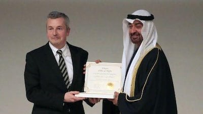 Sheikh Mohammed bin Zayed, Crown Prince of Abu Dhabi and Deputy Supreme Commander of the Armed Forces, presents the Zayed Future Energy Prize to Paul Dickinson, the founder of the Carbon Disclosure Project. Ravindranath K / The National