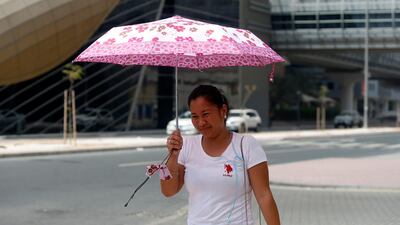 Temperatures were forecast to hit 44C in some parts but cool weather could also continue. Chris Whiteoak / The National