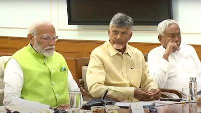 Indian Prime Minister Narendra Modi next to Telugu Desam Party leader N Chandrababu Naidu, center, and Janata Dal (United) leader Nitish Kumar during a meeting at the prime minister's residence in New Delhi on June 5. AP