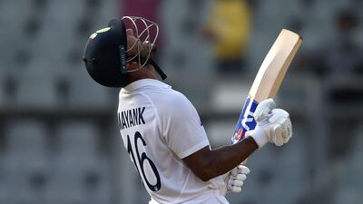 Mayank Agarwal celebrates after scoring a century against New Zealand. AFP