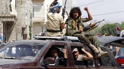 Newly recruited Houthi fighters ride a vehicle during a gathering to mobilise more militants to fight Saudi-backed Yemeni forces in Sanaa. EPA / Yahya Arhab