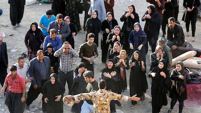 Iranian victims of the earthquake mourn and try to get closer to the body of a relative close to the wreckage of their home in the city of Pole-Zahab, Kermanshah province, on November 13, 2017. Abedin Taherkenareh / EPA