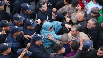 Police officers and protesters confront each other during the demostration. Reuters