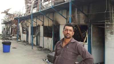 Mohammed Masood, from Pakistan, lives across from the units gutted in a fire at Al Reef Fibrex labour Camp on April 25, 2017. Mr Masood helped rescue fellow workers. Anwar Ahmad / The National