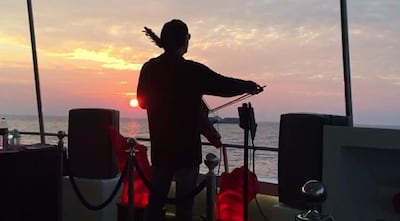 Hansen performing on a yacht in Dubai.