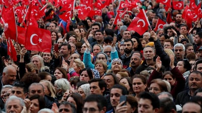 Supporters of main opposition Republican People's Party (CHP) mayoral candidate Ekrem Imamoglu wave Turkish national flags during a gathering in Istanbul amid calls for a rerun. Reuters
