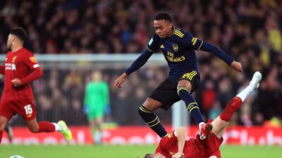 Liverpool's Harvey Elliott and Joe Willock of Arsenal. PA