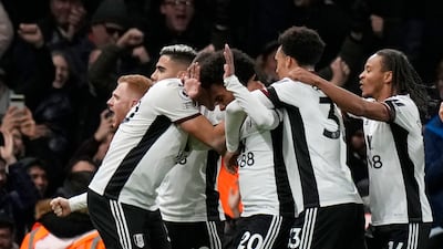Fulham's Willian (c) celebrates with teammates after scoring the opening goal. AP