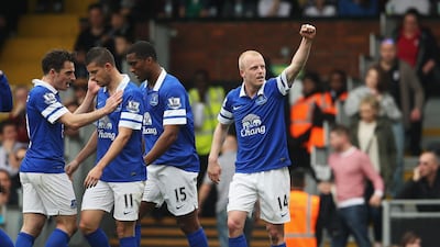 Everton's Steven Naismith celebrates scoring his team's third goal against Fulham on March 30, 2014. Scott Heavey / Getty Images