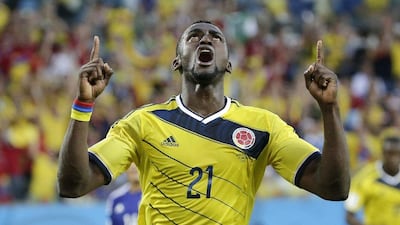 Jackson Martinez celebrates after scoring the first of his two goals against Japan on Tuesday night at the 2014 World Cup in Cuiaba, Brazil. Felipe Dana / AP
